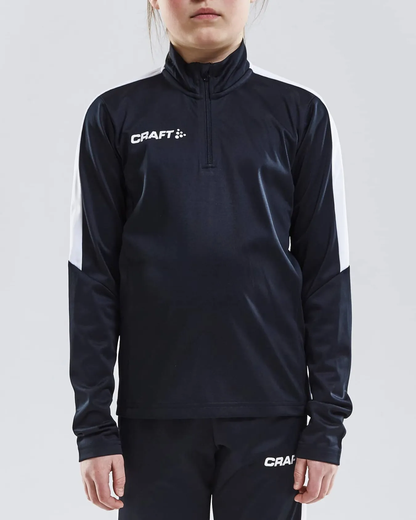 Craft Sportswear T-Shirt^Progress Halfzip Ls Tee Jr Black/White