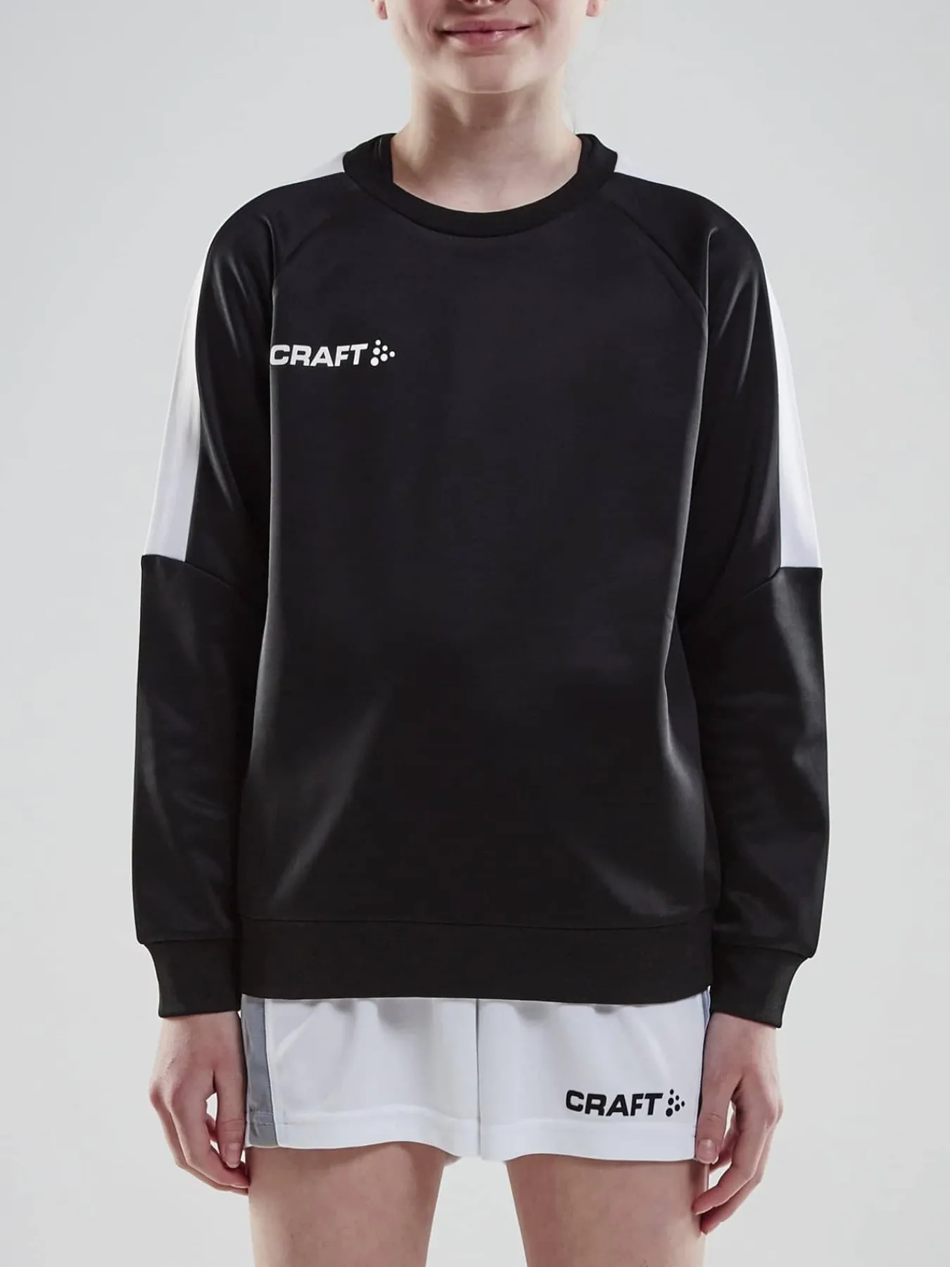 Craft Sportswear Sweatshirts & Hoodies^Progress R-Neck Sweater Jr Black/White